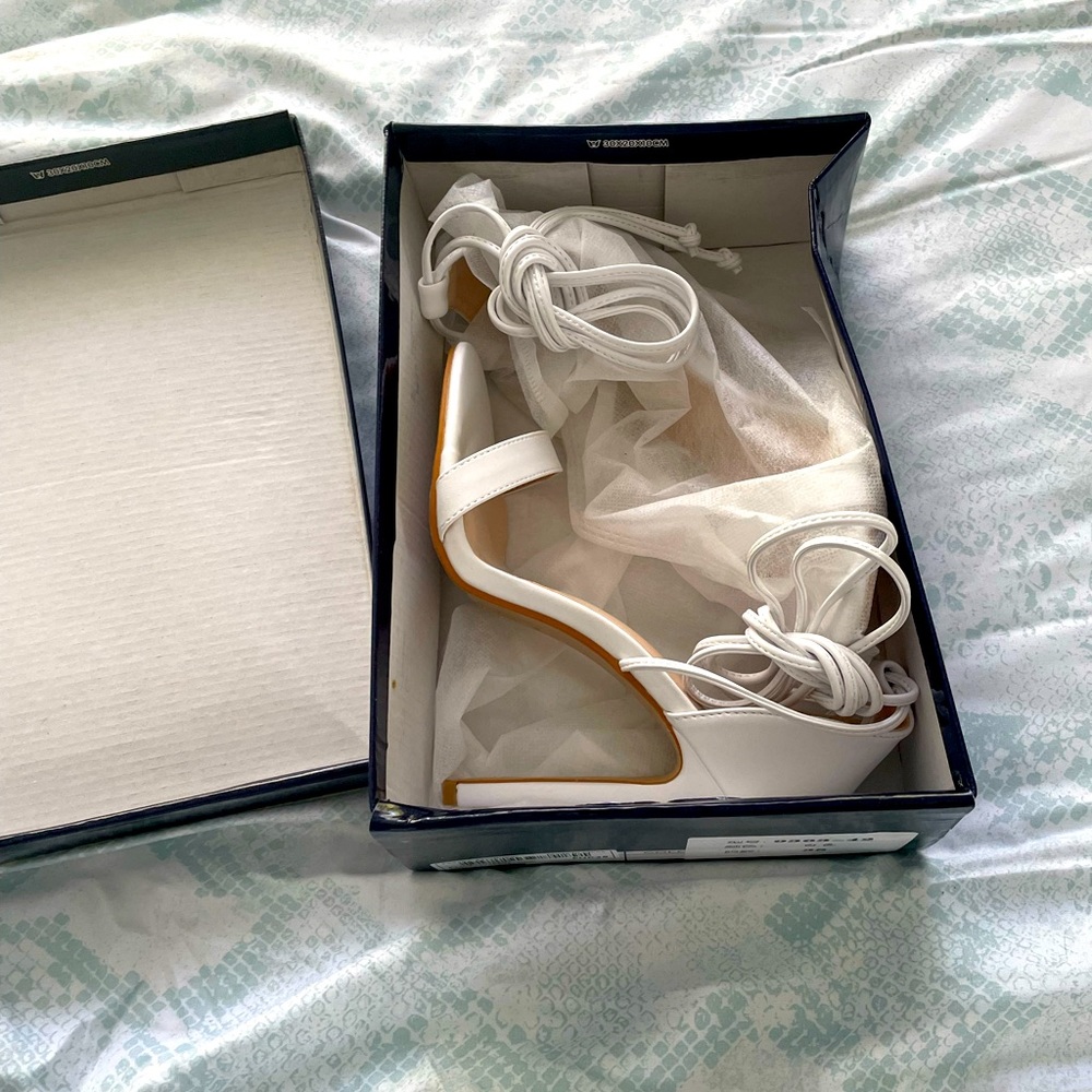 Brand new white high heels with lace up, never worn